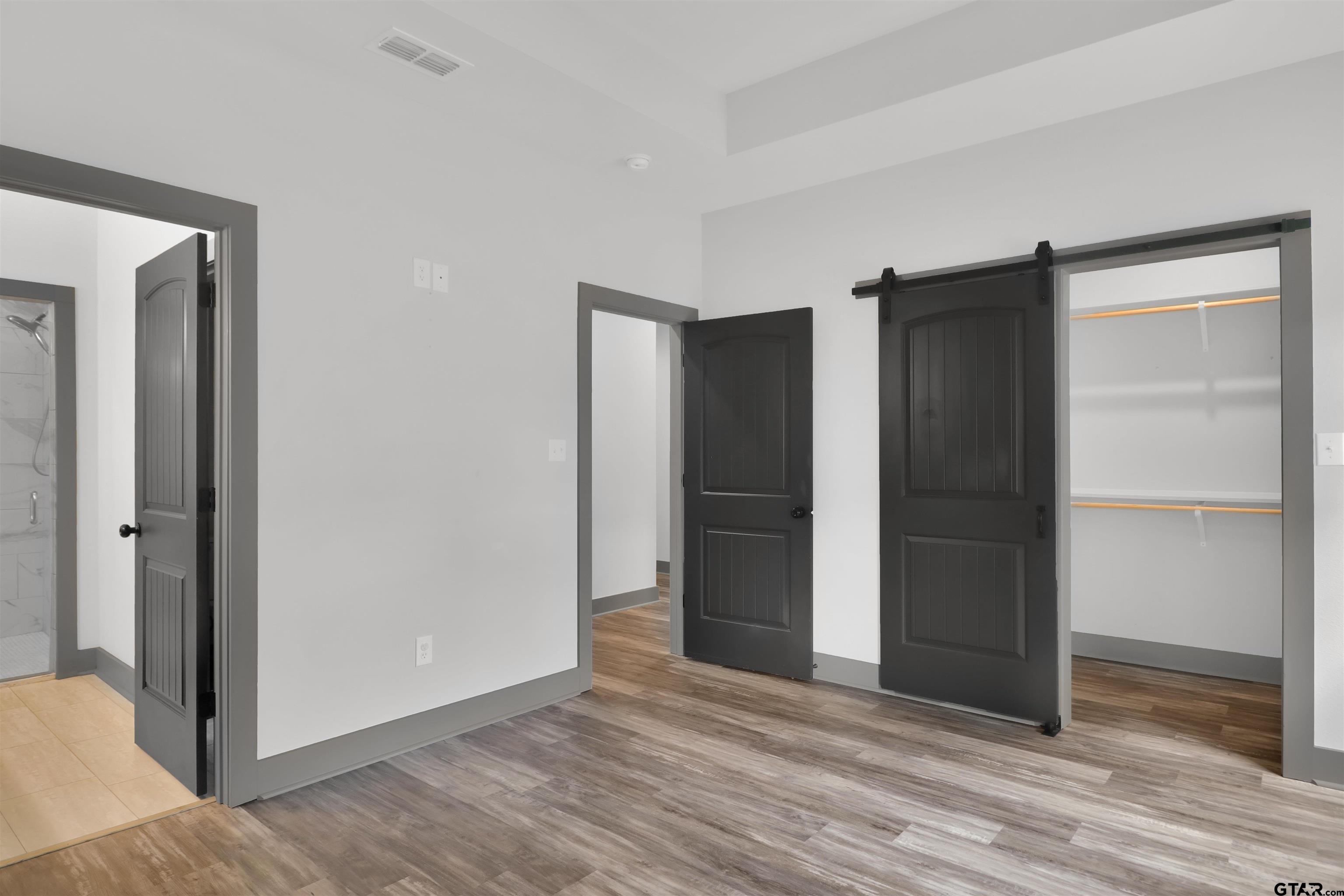 220 Sherman Street Rusk, TX 75785 - Photo 21 of 33 a view of an empty room with wooden floor and closet