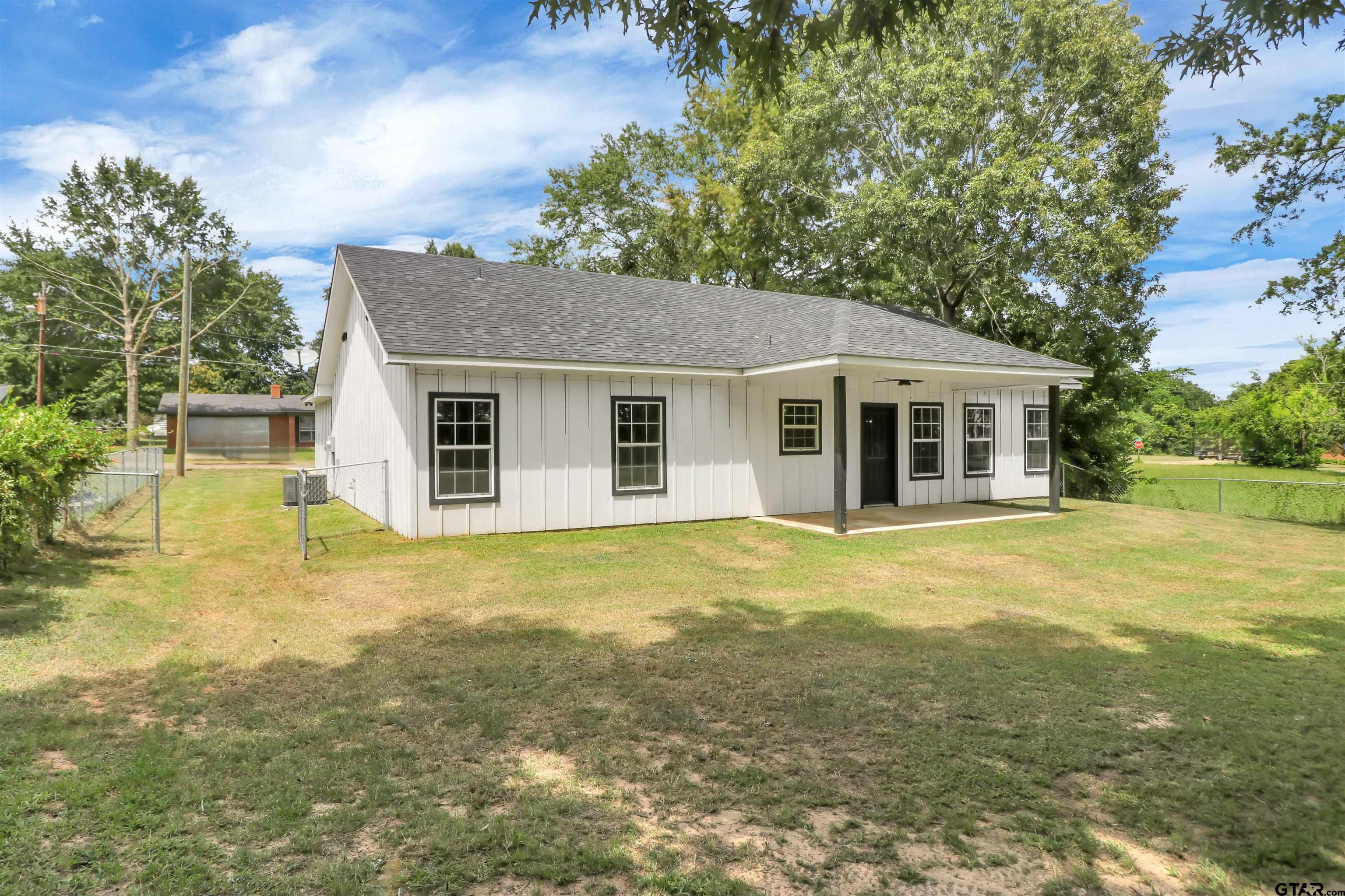 220 Sherman Street Rusk, TX 75785 - Photo 31 of 33 a front view of a house with a garden