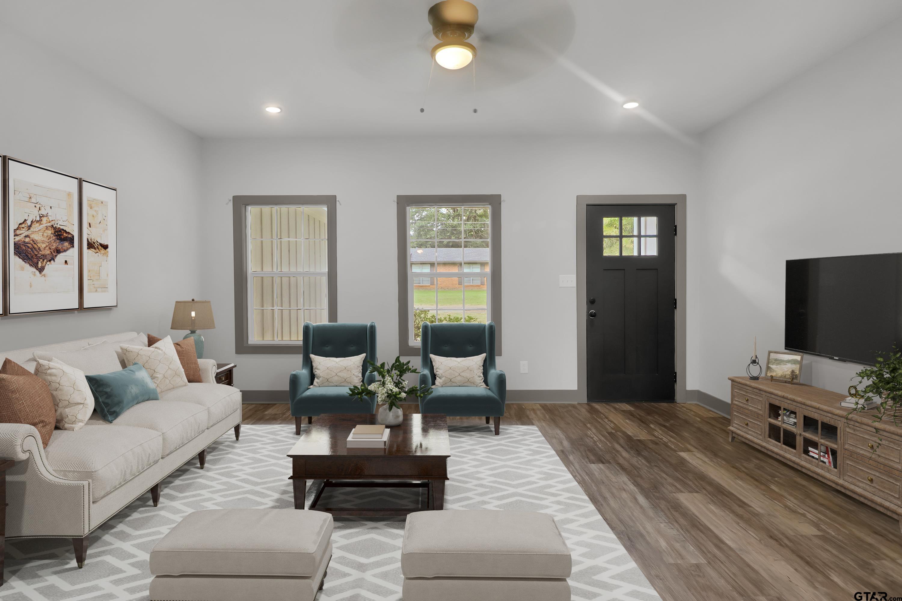 220 Sherman Street Rusk, TX 75785 - Photo 6 of 33 a living room with furniture and a flat screen tv