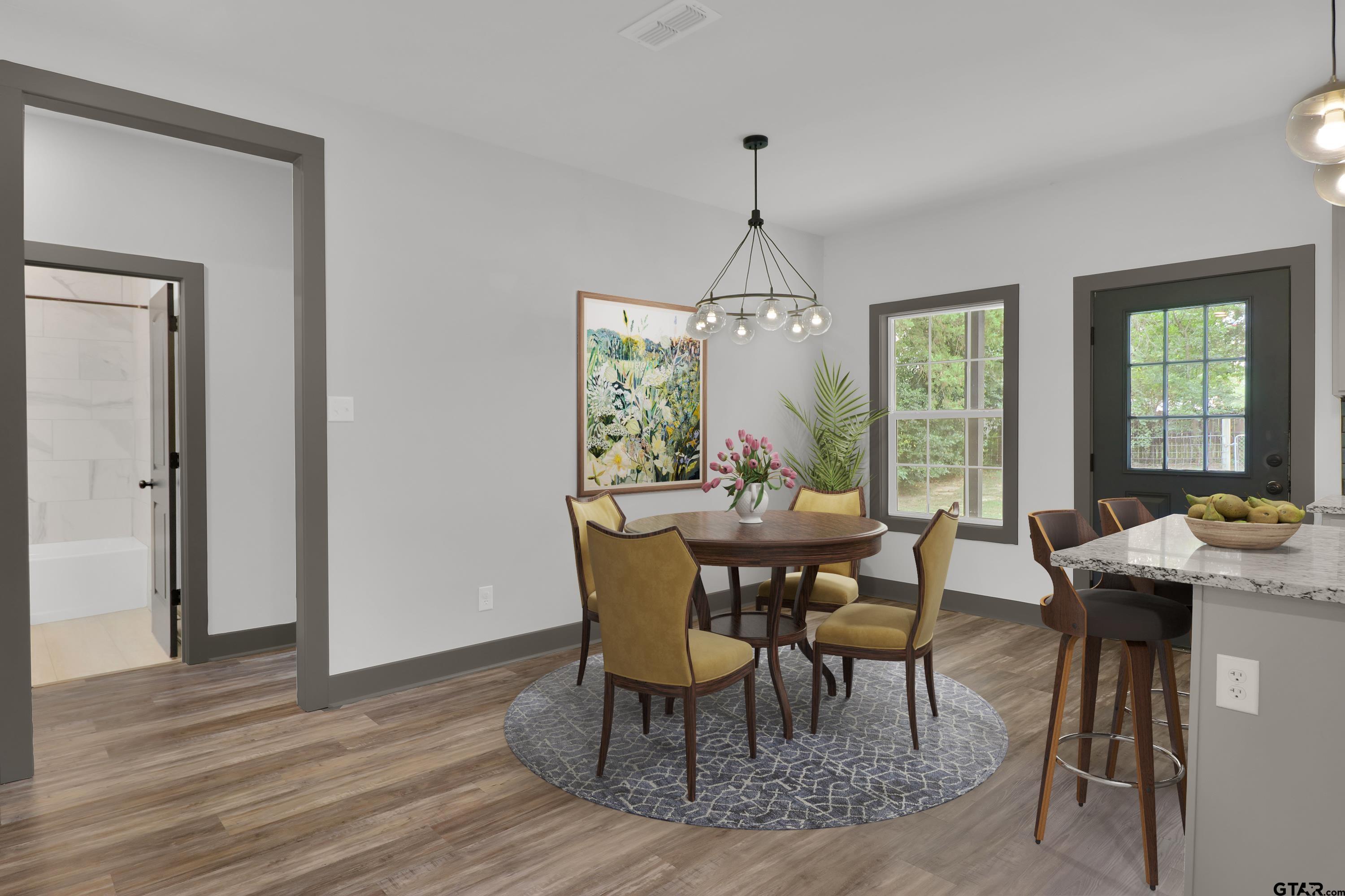 220 Sherman Street Rusk, TX 75785 - Photo 10 of 33 a view of a dining room with furniture window and wooden floor