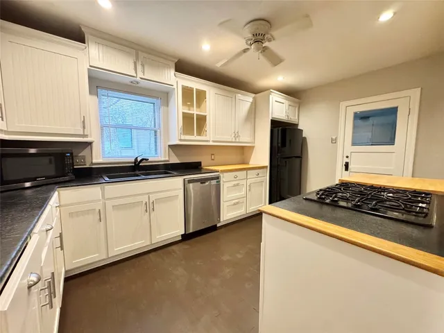 a view of a kitchen with storage and utility