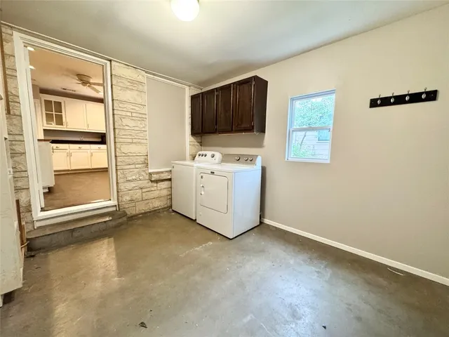 a view of a bathroom with a sink and a mirror