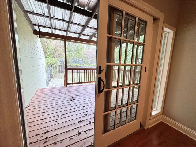 a view of porch with wooden floor