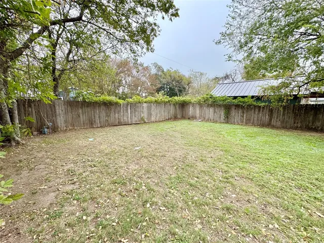 a bathroom with a shower sink and mirror