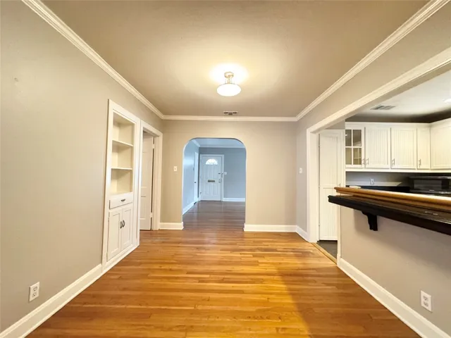 a kitchen with granite countertop a refrigerator stove top oven and sink