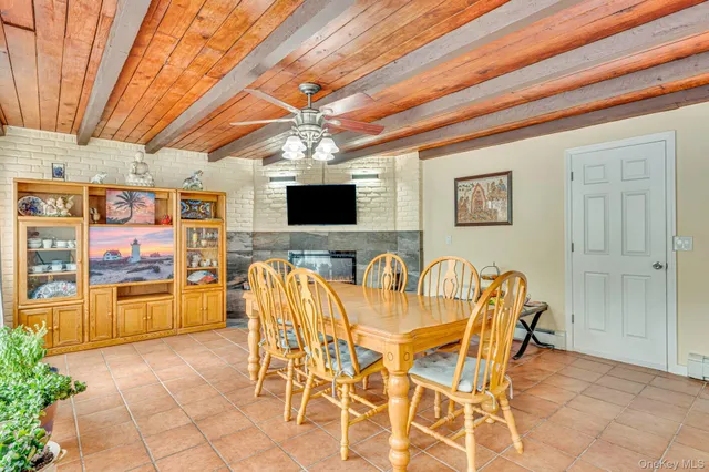 a dining space with furniture and chandelier