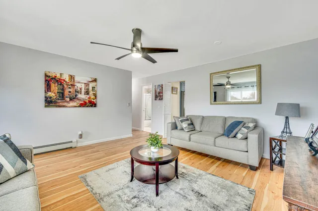 a living room with furniture and a rug