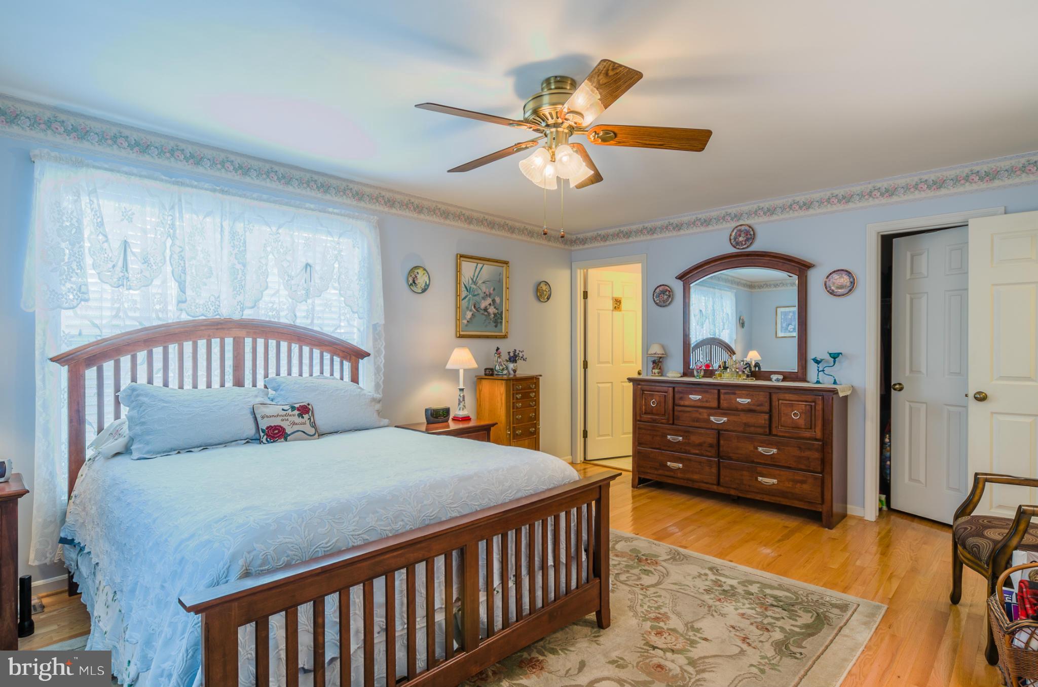 8620 Sandy Plains Road Baltimore, MD 21222 - Photo 11 of 30 a bedroom with a bed and a dresser