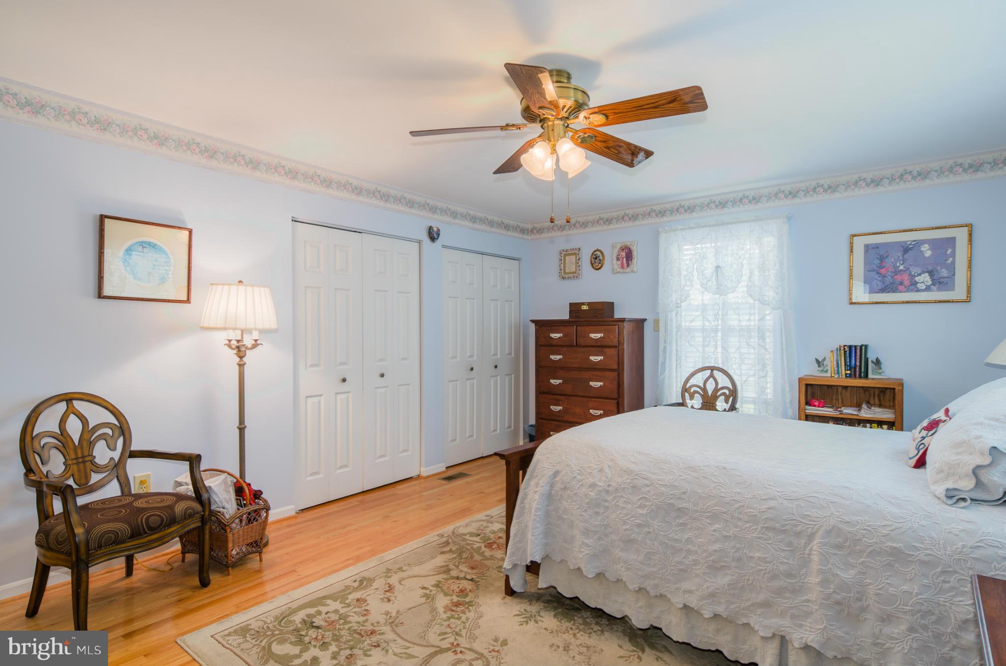 8620 Sandy Plains Road Baltimore, MD 21222 - Photo 12 of 30 a bedroom with a bed and a chandelier