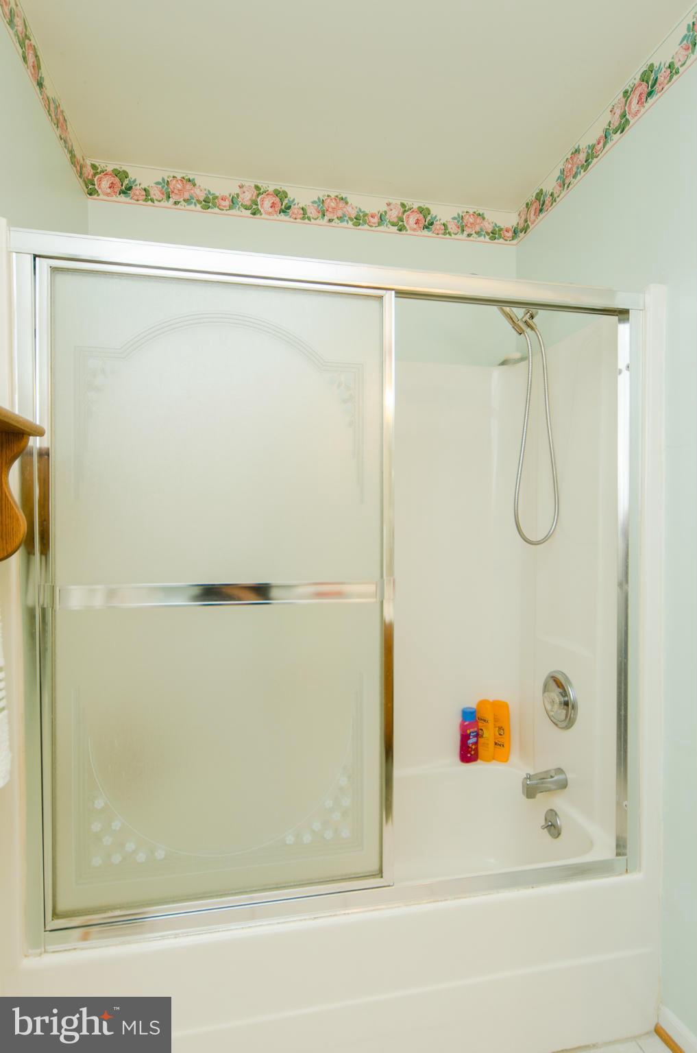 8620 Sandy Plains Road Baltimore, MD 21222 - Photo 17 of 30 a bathroom with a bathtub and a shower