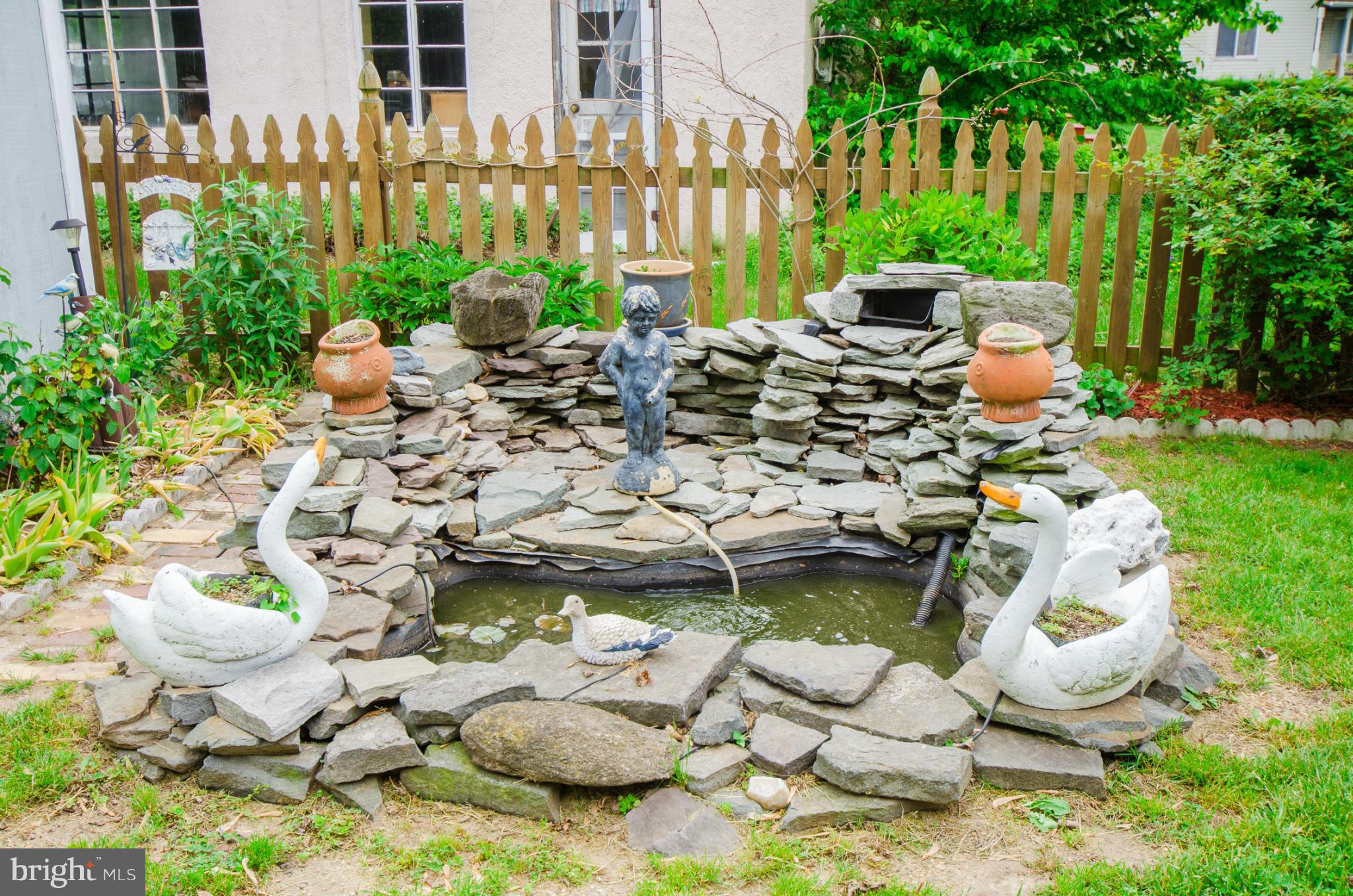8620 Sandy Plains Road Baltimore, MD 21222 - Photo 22 of 30 a bunch of bottles of flowers sitting in front of house