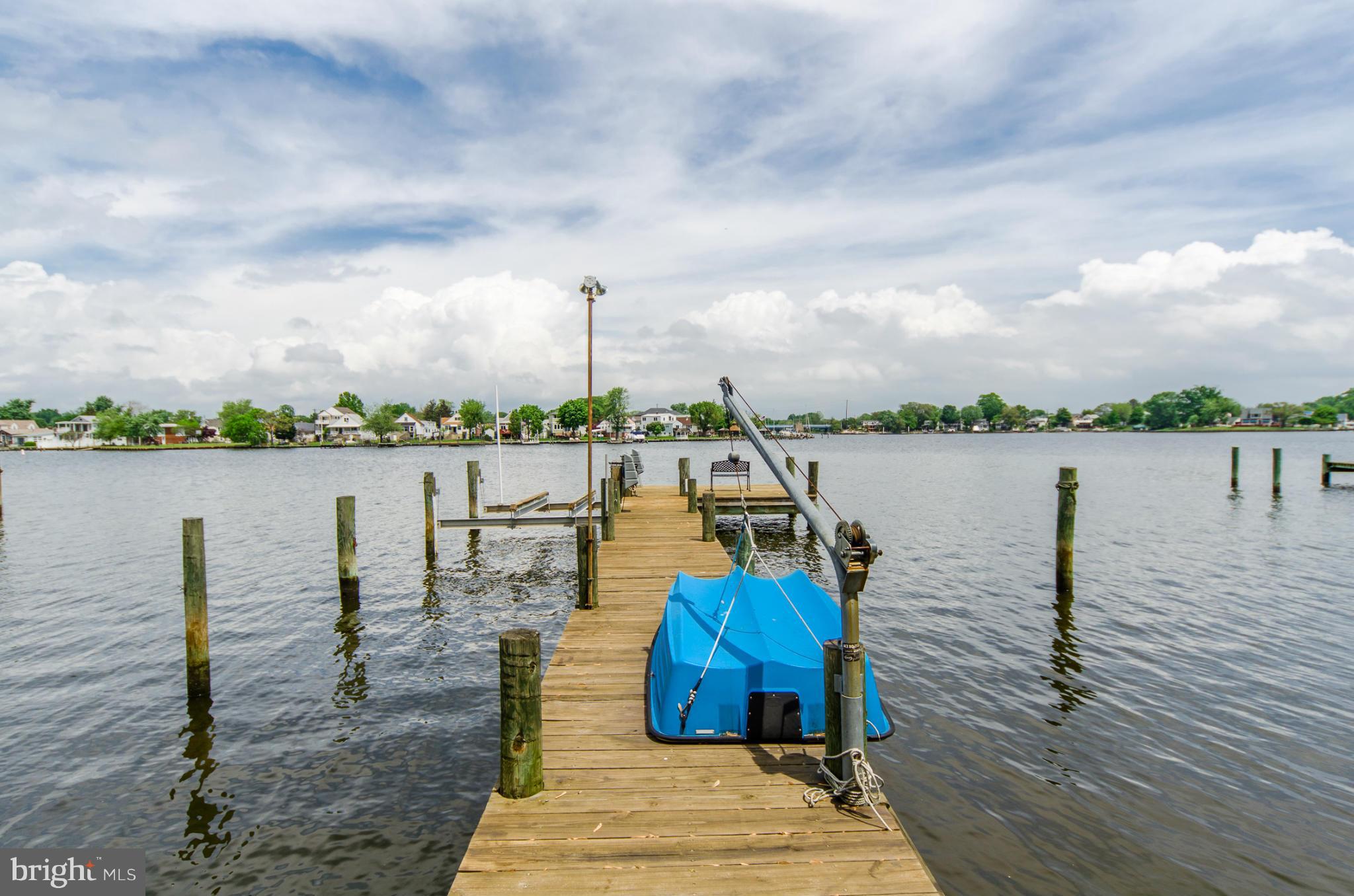 8620 Sandy Plains Road Baltimore, MD 21222 - Photo 24 of 30 a view of a lake with boats and large trees