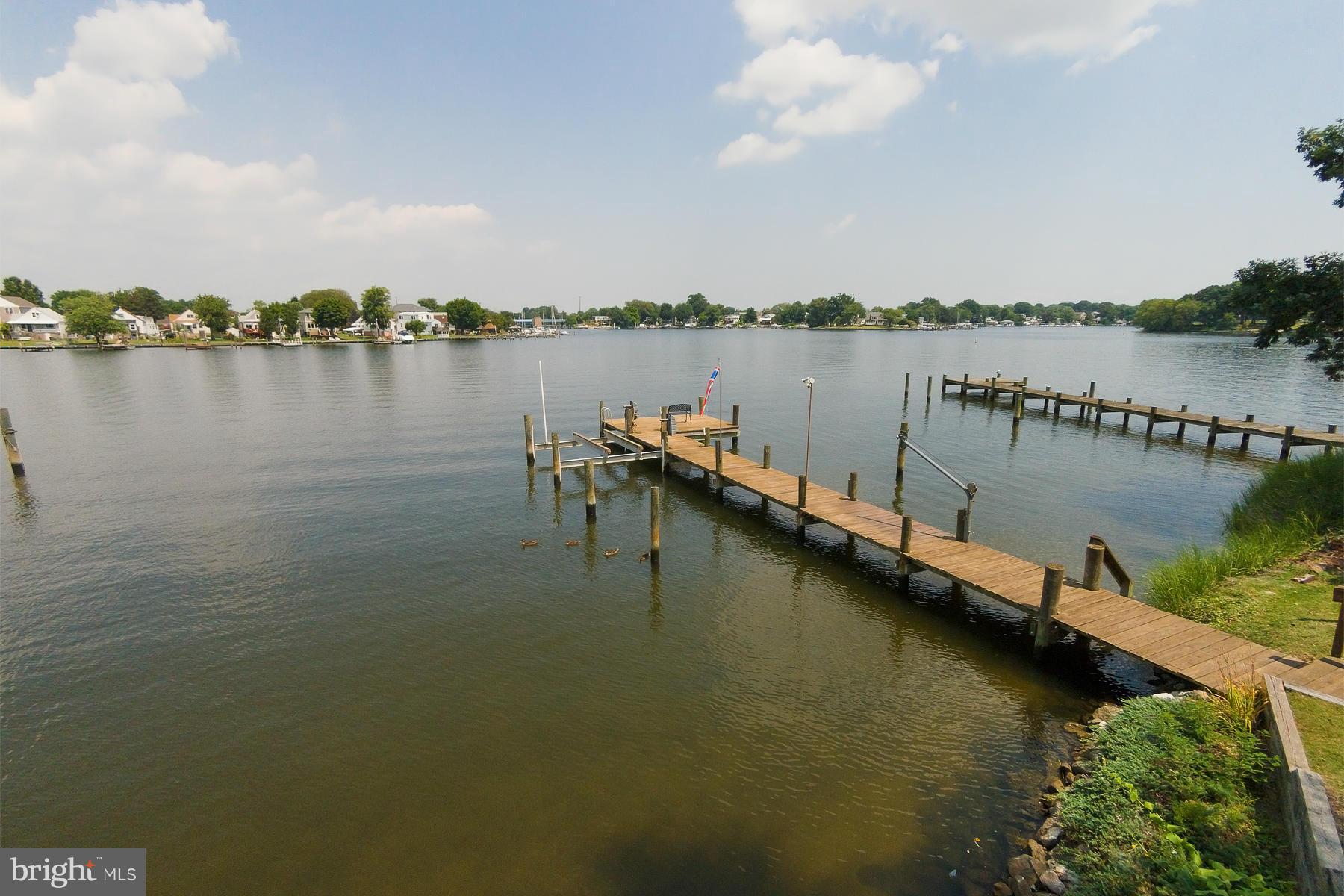 8620 Sandy Plains Road Baltimore, MD 21222 - Photo 25 of 30 a view of a lake with houses in the back
