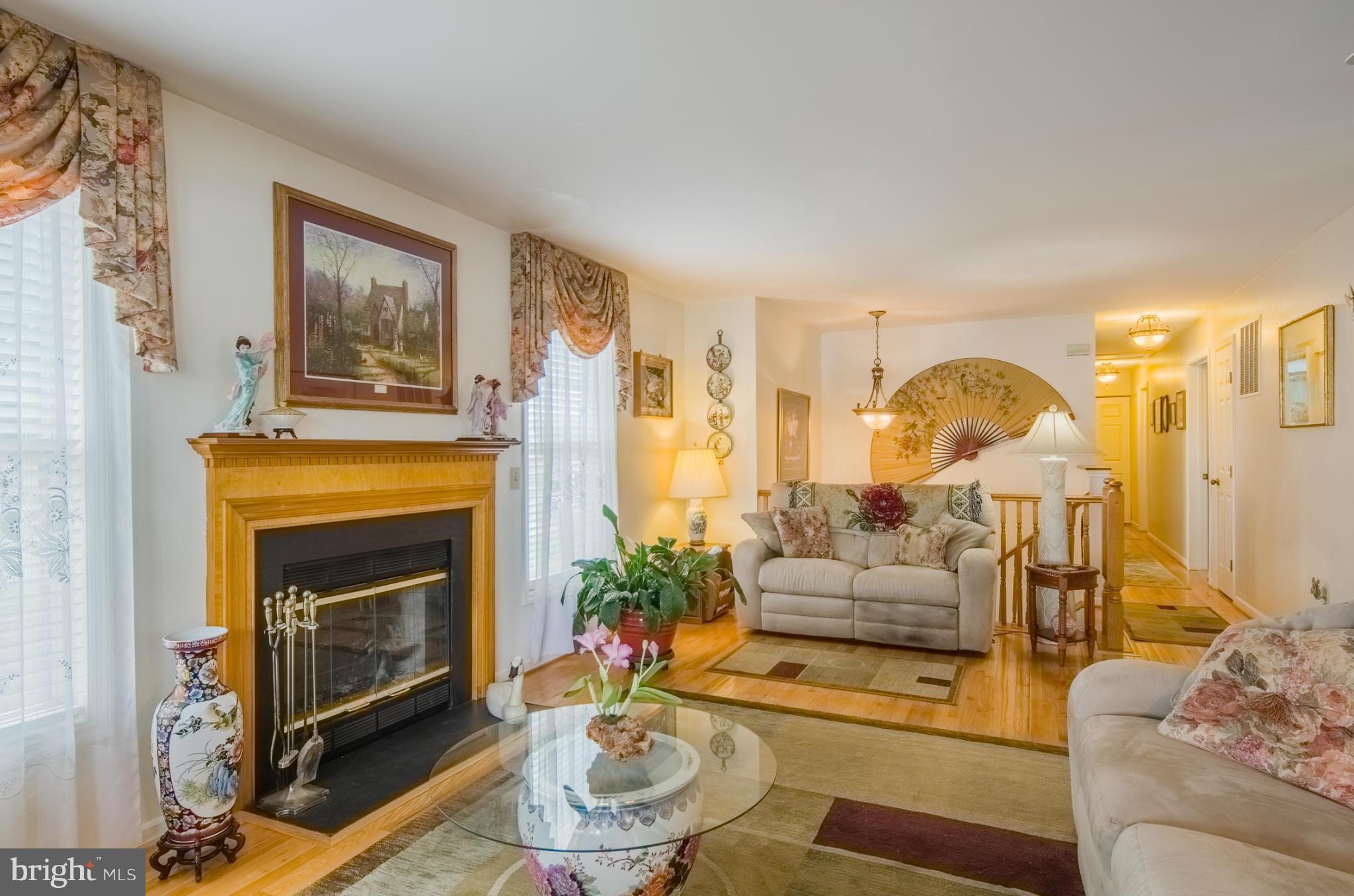 8620 Sandy Plains Road Baltimore, MD 21222 - Photo 4 of 30 a living room with furniture and a fireplace