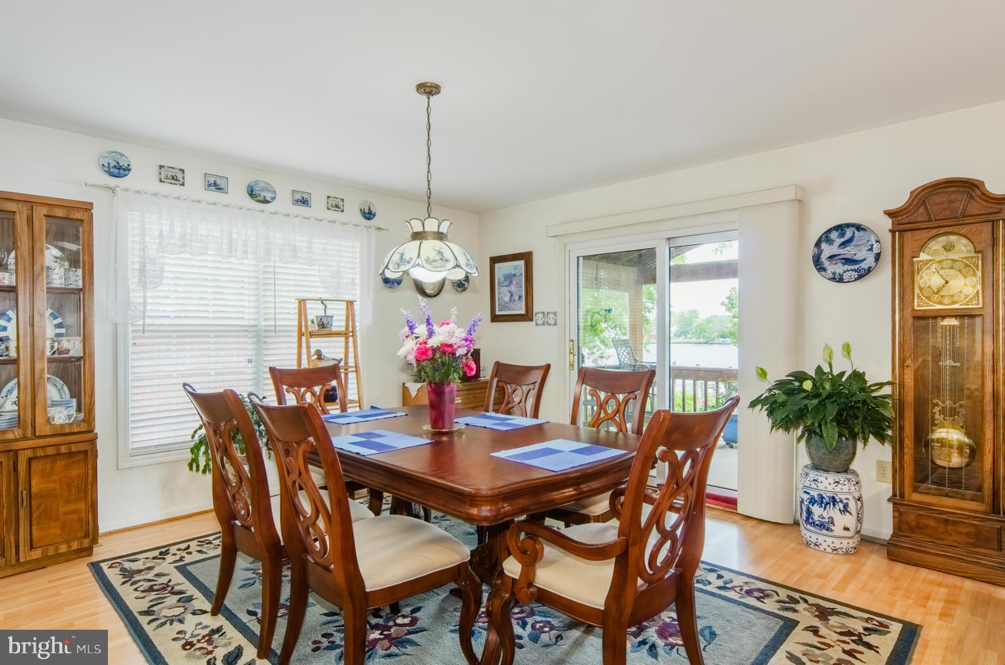 8620 Sandy Plains Road Baltimore, MD 21222 - Photo 6 of 30 a view of a dining room with furniture window and wooden floor