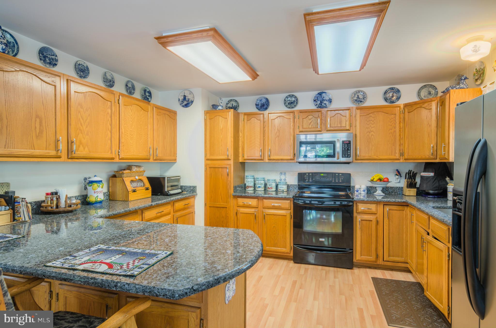 8620 Sandy Plains Road Baltimore, MD 21222 - Photo 8 of 30 a kitchen with stainless steel appliances granite countertop a sink stove and refrigerator