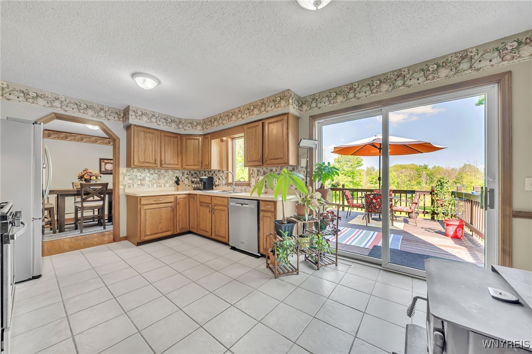 1845 Maxon Road Bennington, NY 14011 - Photo 15 of 50 Kitchen & Deck Entrance