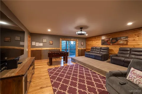 a large room with lots of furniture and a flat screen tv