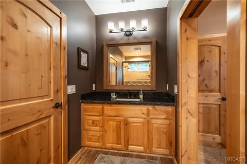 a bathroom with a toilet sink shower and mirror