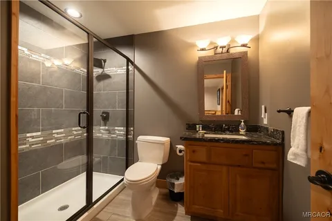 a living room with furniture a ceiling fan and a window