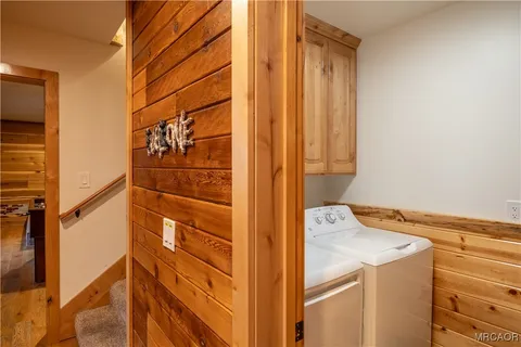 a view of balcony with wooden floor and outdoor seating