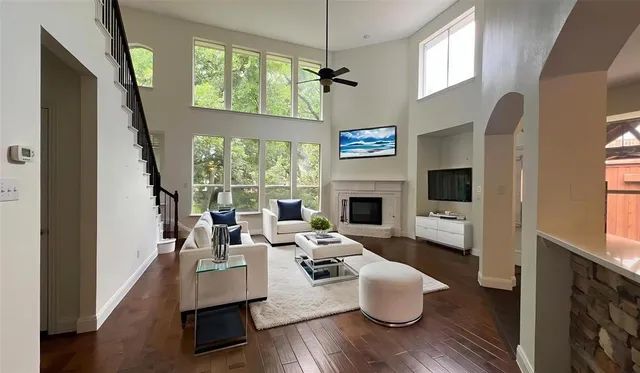 a living room with furniture fireplace and a flat screen tv