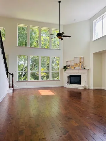 a view of a kitchen with a sink and a fireplace