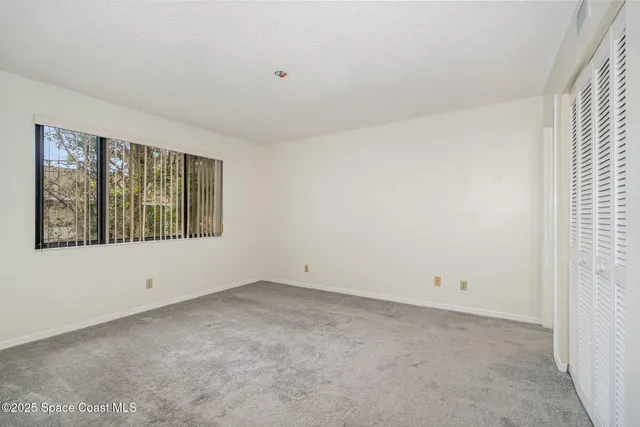 an empty room with window