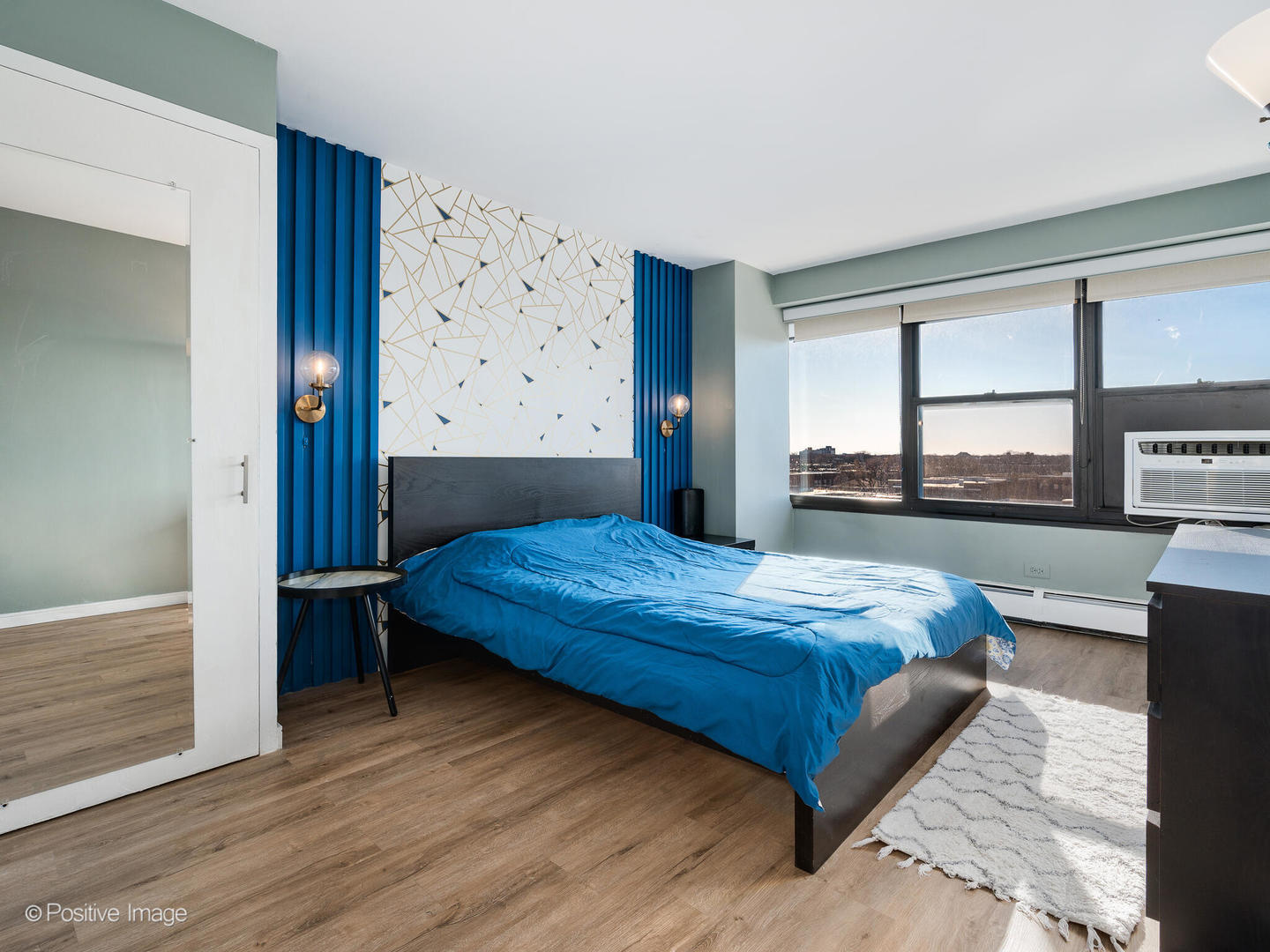 6030 North Sheridan Road, Unit 703 Chicago, IL 60660 - Photo 14 of 15 a bedroom with a bed and a window