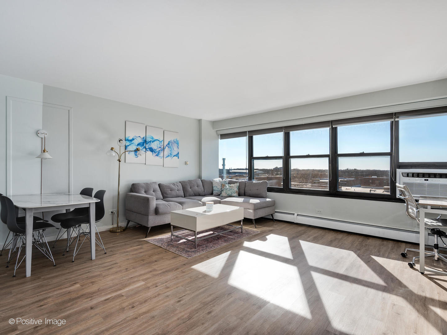 6030 North Sheridan Road, Unit 703 Chicago, IL 60660 - Photo 5 of 15 a living room with furniture and a large window
