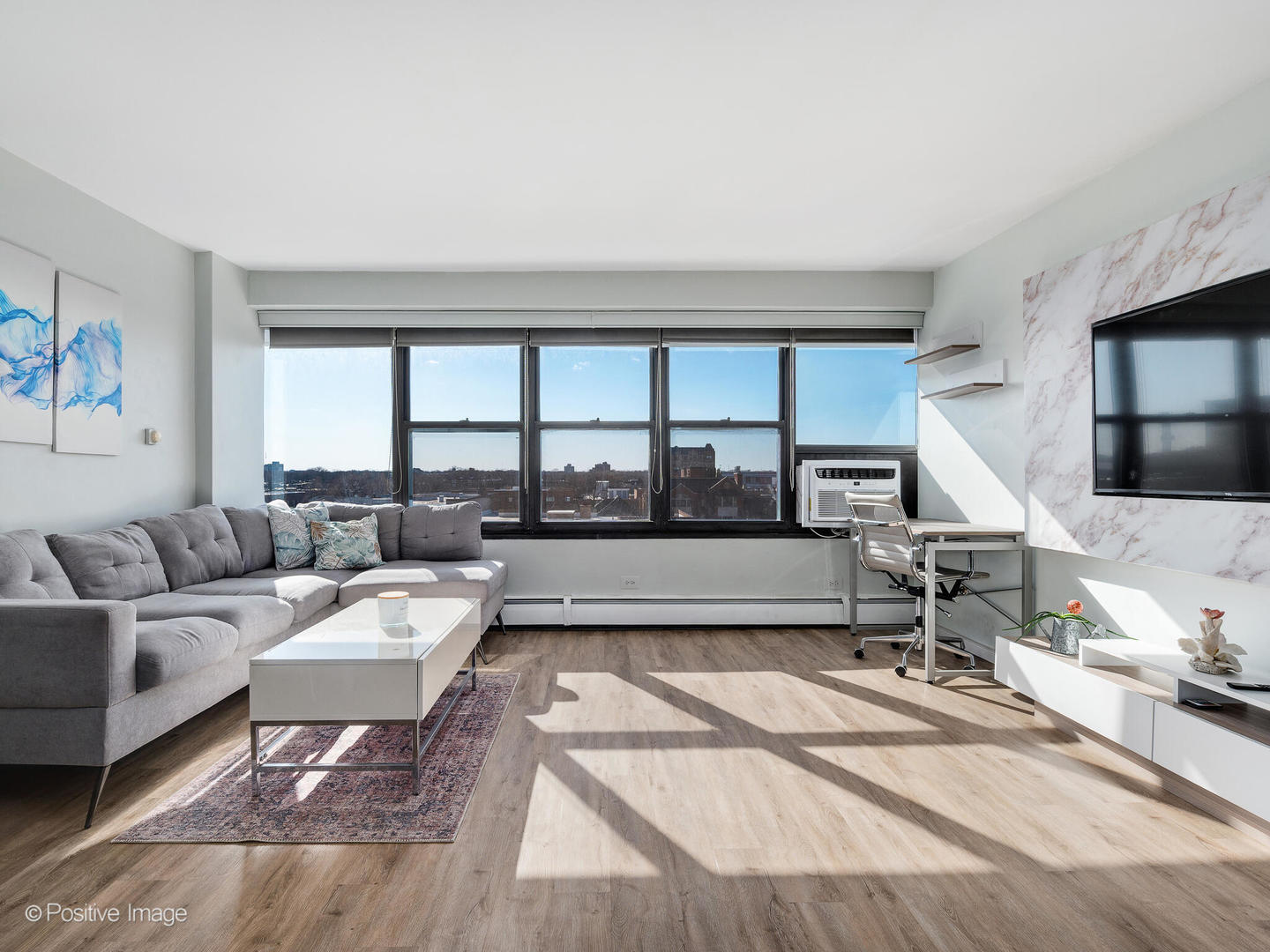 6030 North Sheridan Road, Unit 703 Chicago, IL 60660 - Photo 6 of 15 a living room with furniture and a large window