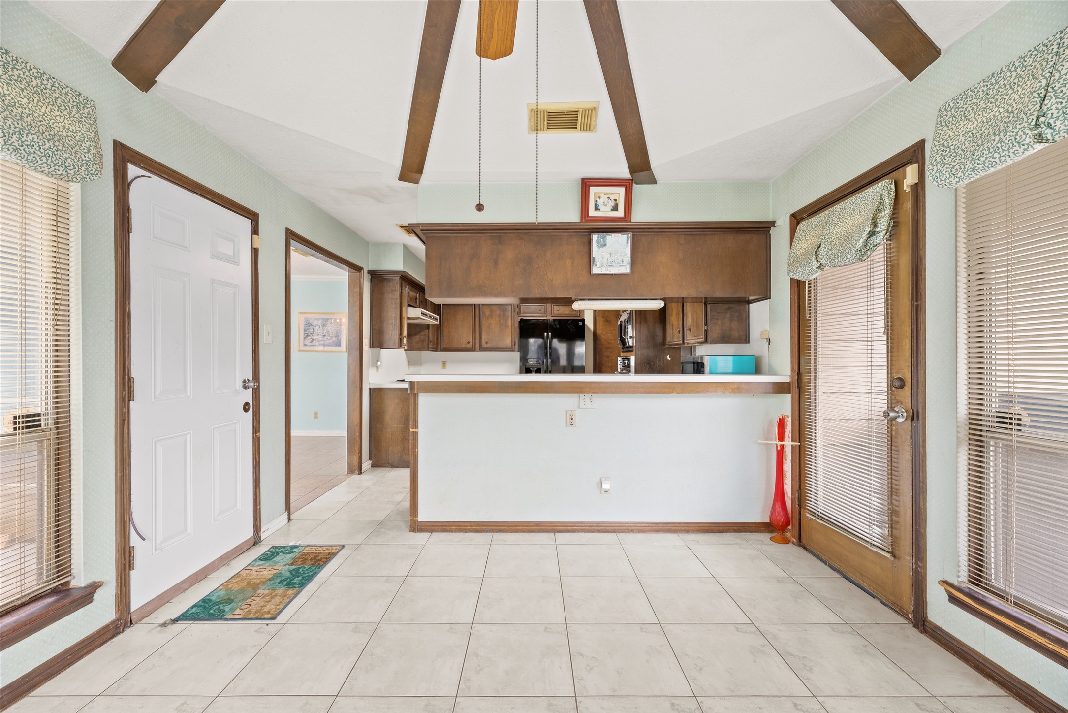 14915 Sun Harbor Drive Houston, TX 77062 - Photo 10 of 28 a kitchen with stainless steel appliances a refrigerator and microwave