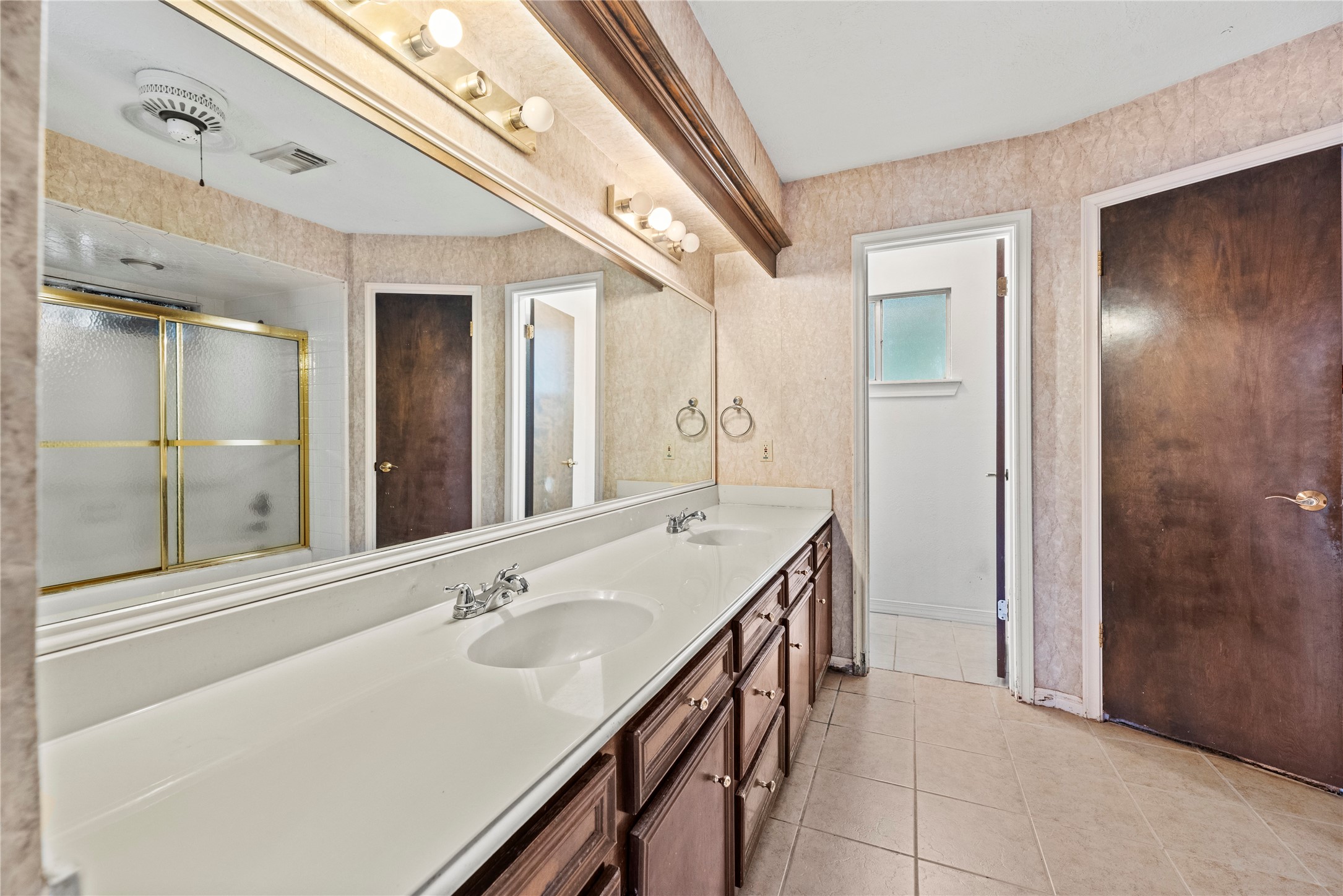 14915 Sun Harbor Drive Houston, TX 77062 - Photo 16 of 28 a spacious bathroom with a double vanity sink and a mirror