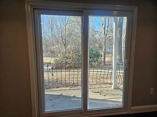 a view of a room that has a large window