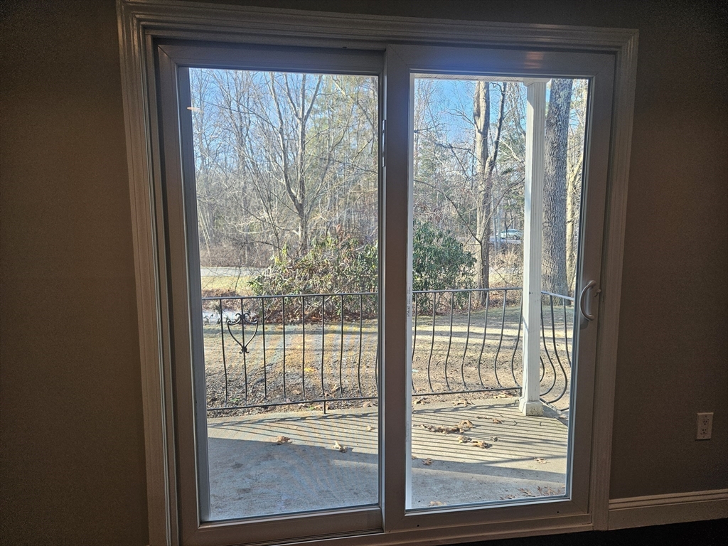 10 Shadowbrook Lane, Unit 19 Milford, MA 01757 - Photo 6 of 11 a view of a room that has a large window