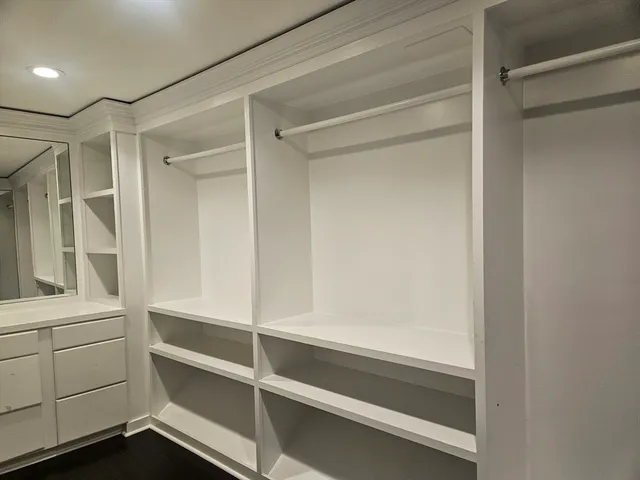a view of an empty walk in closet