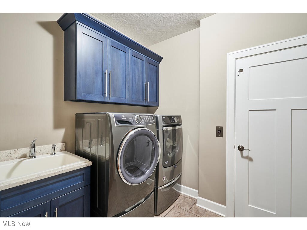 1570 Shade Road Akron, OH 44333 - Photo 15 of 45 The first for laundry with tiled flooring and access to the elevator.