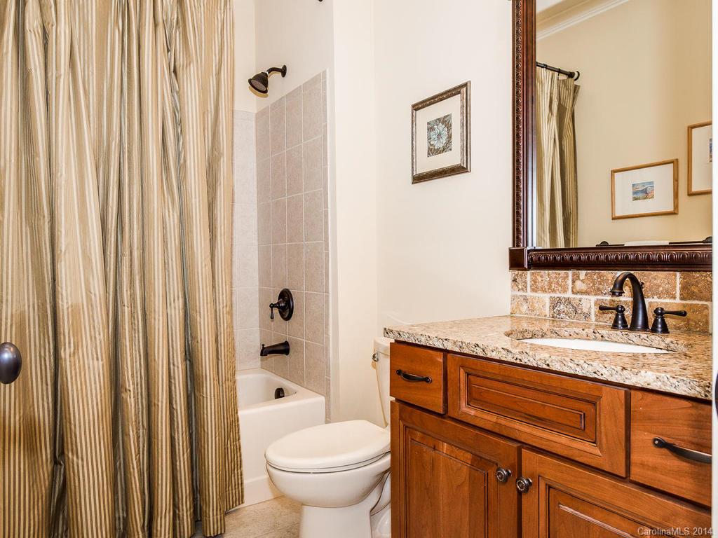 2641 Houston Branch Road Charlotte, NC 28270 - Photo 22 of 24 a bathroom with a granite countertop sink and a mirror