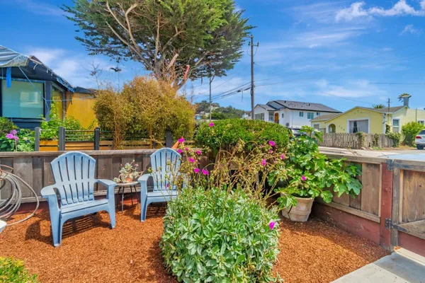 a view of a chairs and table in the patio