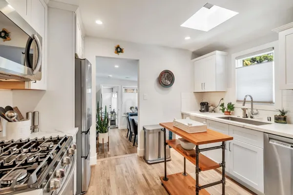 a kitchen with a table and chairs in it