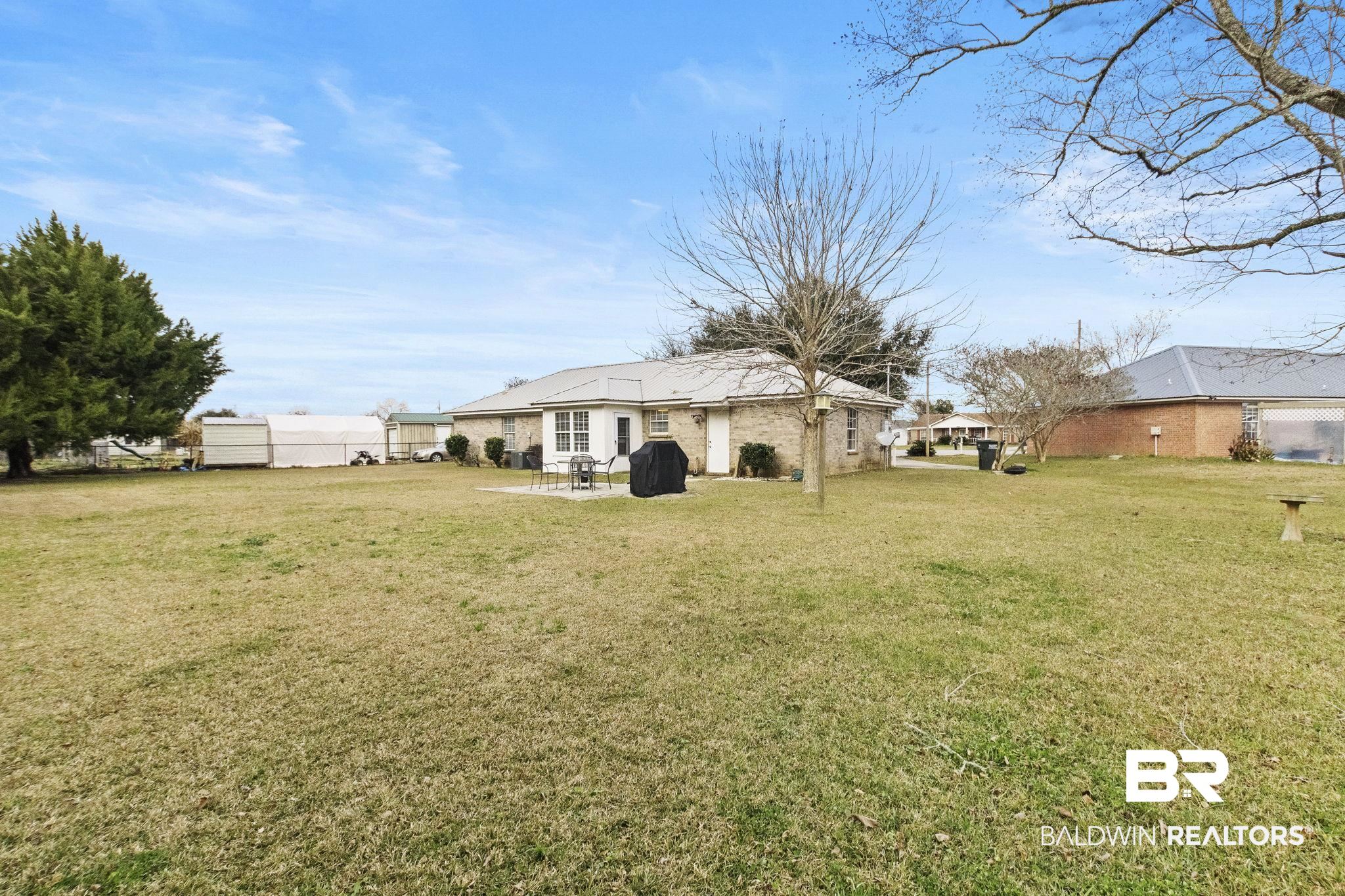 14031 Brook Hollow Road Summerdale, AL 36580 - Photo 46 of 56 View of yard with a patio