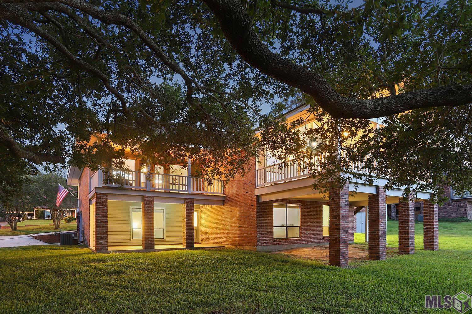11675 Rue De Tonti Baton Rouge, LA 70810 - Photo 2 of 42 Dusk Back View of Home