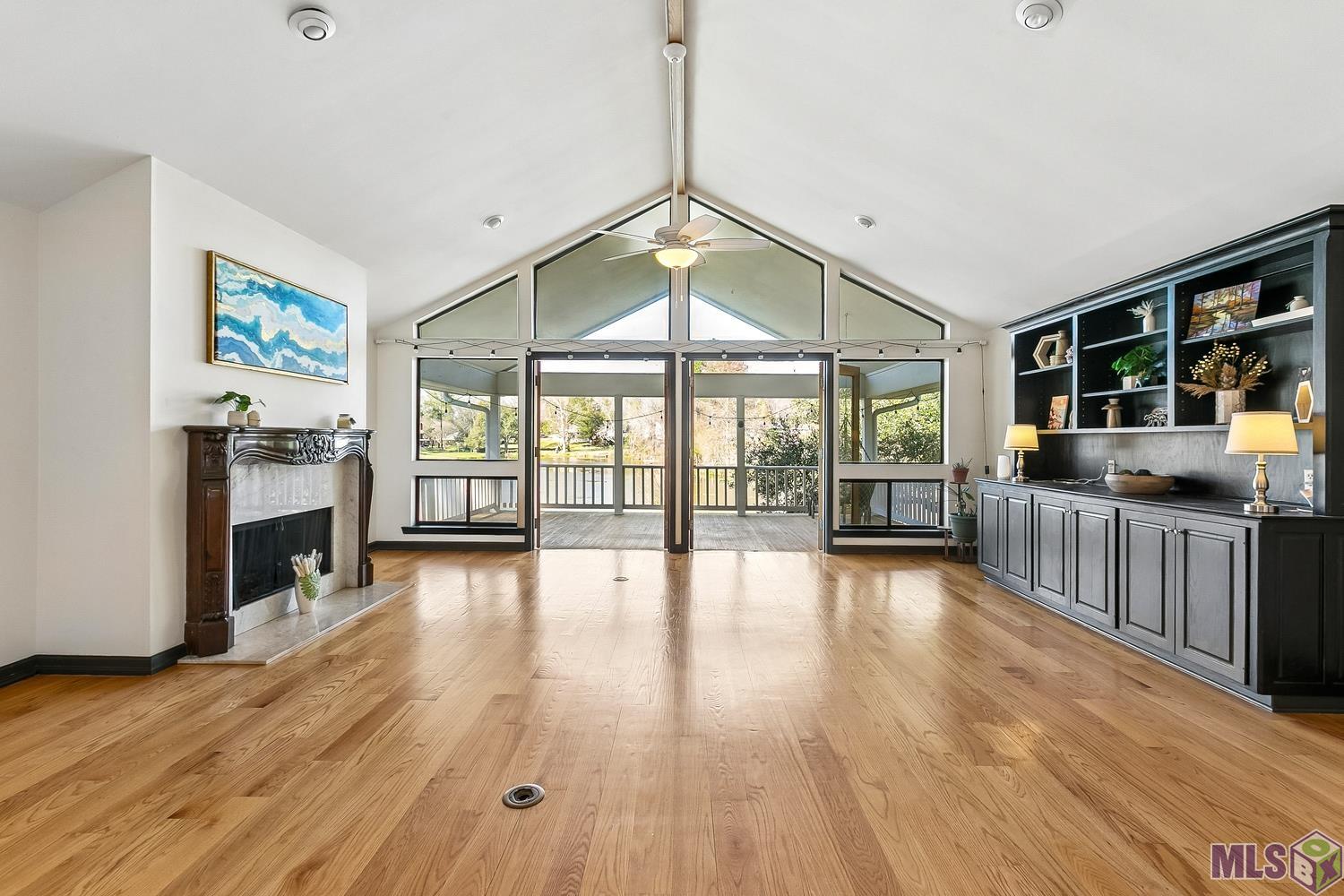 11675 Rue De Tonti Baton Rouge, LA 70810 - Photo 6 of 42 Living Room looking onto balcony and lake