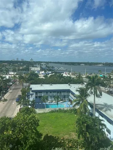a kitchen with a sink a stove top oven and cabinets