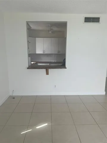 a bathroom with a toilet sink and shower