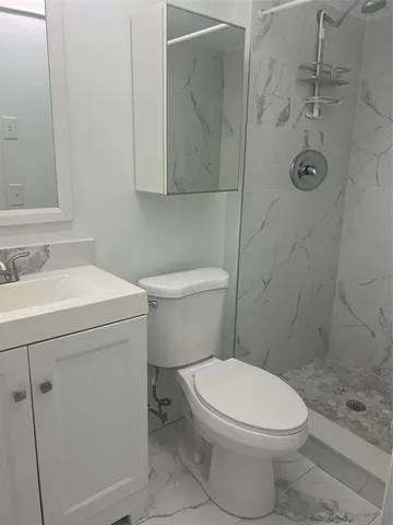 a bathroom with a sink a toilet and a bathtub