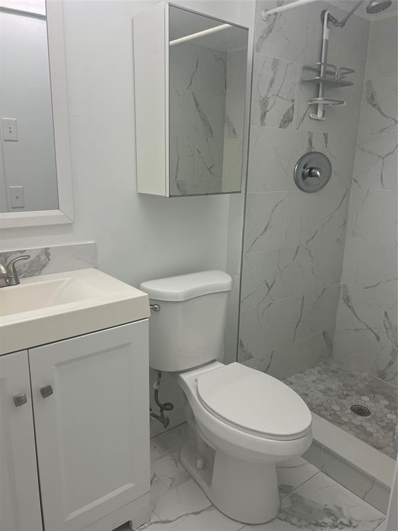 400 North Surf Road, Unit 806 Hollywood, FL 33019 - Photo 20 of 41 a bathroom with a toilet sink and shower