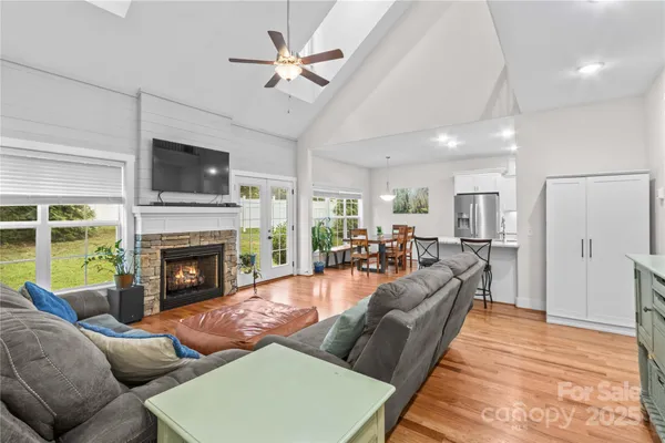 a living room with furniture fireplace and a flat screen tv