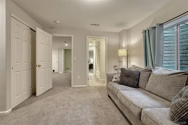 a living room with furniture and a large window