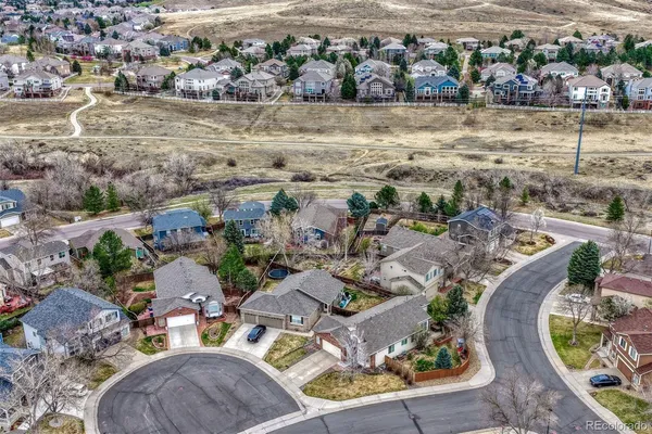 an aerial view of a house with a ocean view
